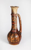 PAINTED TERRA COTTA JUG with long neck issuing a loop handle joining the globular bowl, painted in