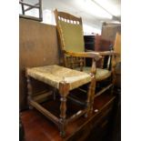 AN OAK OPEN ARMCHAIR, HAVING FABRIC COVERED BACK AND SEAT (POSSIBLY A ROCKING CHAIR), AND AN