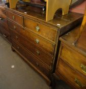 LATE GEORGIAN OAK CHEST OF TWO SHORT AND THREE GRADUATED LONG DRAWERS, ON BRACKET FEET, (LATER METAL