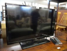 A JVC 28" FLAT SCREEN TV WITH REMOTE CONTROL