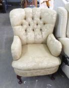 VICTORIAN STYLE BUTTON UPHOLSTERED EASY ARMCHAIR, COVERED IN GOLD AND LEAF PATTERN DAMASK, ON SEMI-