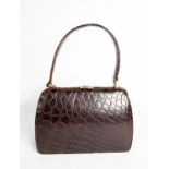 RIVIERA BAG, made in England; a lady's Art Deco style crocodile HANDBAG, with stylised gilt metal
