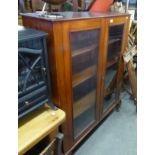 19TH CENTURY MAHOGANY BOOKCASE ENCLOSED BY TWO GLAZED DOORS, ON STUMP CABRIOLE SUPPORTS, THREE