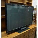 A PANASONIC 42" FLAT SCREEN TV WITH REMOTE CONTROL, MODEL TX-P42X50B