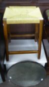 A WOODEN STOOL WITH OBLONG RUSH SEAT; A MAHOGANY OBLONG FOOTSTOOL, WITH UPHOLSTERED TOP; A