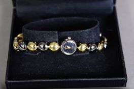 LADY'S ACCURIST GOLD PLATED BRACELET WATCH, with quartz movement, circular dial and bi-colour beaded