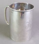 GEORGE V PLAIN SILVER CHRISTENING MUG, of tapering form with loop handle, initialled and dated, 3 ¼”