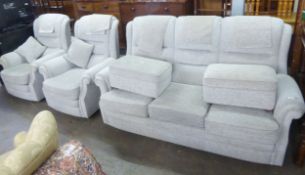 A MODERN SEMI-WINGED LOUNGE SUITE OF FIVE PIECES COVERED IN WHITE AND FAWN WEAVE, COMPRISING A