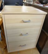 A BLOND WOOD SMALL CHEST OF THREE DRAWERS