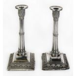 GEORGE V PAIR OF MOULDED AND WEIGHTED SILVER TABLE CANDLESTICKS, each of cluster column form with