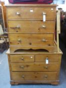 AN ANTIQUE PINE CHEST OF TWO SHORT OVER TWO LONG DRAWERS AND A PINE CHEST OF 3 DRAWERS (2)