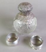 EDWARD VII PIERCED SILVER MOUNTED GLOBULAR CUT GLASS SCENT BOTTLE, with internal glass stopper and