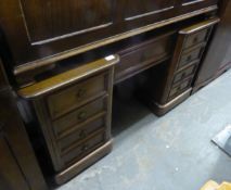 A MAHOGANY DOUBLE PEDESTAL BREAKFRONT DESK, WITH LEDGE BACK, SEVEN DRAWERS INCLUDING TWO DEEP FILING