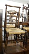 AN OAK WINDSOR COUNTRY STYLE LADDER-BACK DINING CHAIR, WITH RUSH SEAT, HAVING TURNED CROSS STRETCHER