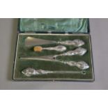 LADY’S CASED FOUR PIECE VANITY SET IN STEEL WITH FILLED SILVER HANDLES, comprising: SHOE HORN, SMALL