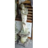 1970's COMPOSITE STONE GARDEN STATUE, IN THE FORM OF A SEMI-NUDE FEMALE ON LOTUS LEAF AND IONIC