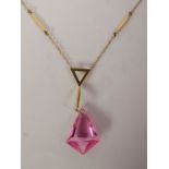 PINK PASTE PENDANT NECKLACE, a kite-shaped pink paste drop suspended from a fancy surmount, to a