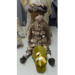 MERRYTHOUGHT’ GOLD PLUSH FABRIC STUFFED TOY ‘HIPPO’, 9” LONG AND A BISQUE SHOULDER HEADED GIRL DOLL,