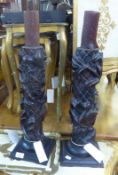 A PAIR OF CARVED WOOD PICKET CANDLESTICKS