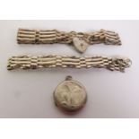 TWO SILVER GATE PATTERN BRACELETS and padlocks AND A SILVER CIRCULAR LOCKET PENDANT (3)