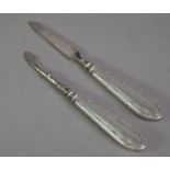 PAIR OF MANICURE IMPLEMENTS WITH FILLED SILVER HANDLES, (2)