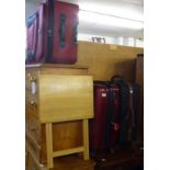 A MAROON FIBRE GLASS SUITCASE, ZIP FASTENING ON WHEELS AND TWO CANVAS SUITCASES, VARIOUS AND A
