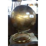 A TERRESTRIAL GLOBE, ON METAL STAND