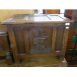 A SMALL JACOBEAN STYLE OAK COFFER, WITH FRAMED THREE PANEL LID, WITH IRON BUTTERFLY HINGES, THE