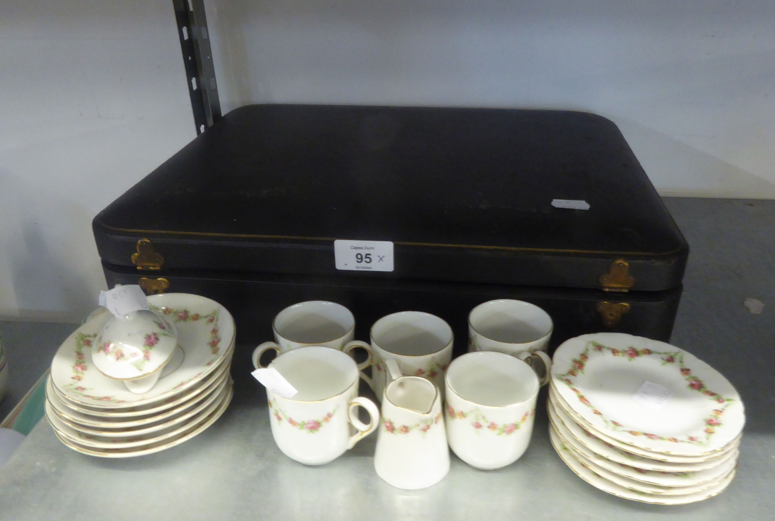 A 19 PIECE GERMAN PORCELAIN CHILD'S TEA SET, INCLUDING; A COVER FOR TEAPOT AND A CASE