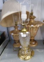 A CUT GLASS TABLE LAMP WITH SHADE AND A POTTERY GILT AND RED DECORATED URN SHAPED LAMP WITH SHADE