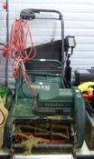 AN ATCO WINDSOR 14S SELF PROPELLED ELECTRIC CYLINDER LAWN MOWER AND GRASS BOX
