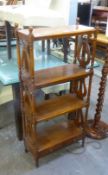 A MAHOGANY REPRODUCTION FOUR TIER OPEN BOOKCASE/WHAT-NOT, HAVING TWO SMALL DRAWERS BELOW, THE OPEN