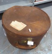 LEATHER HAT BOX WITH CARRYING HANDLE, CONTAINING A LADIES HAT.