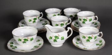 TWENTY ONE PIECE COLCLOUGH CHINA TEASET FOR SIX PERSONS, colour printed with trailing vines within