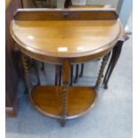 AN OAK SEMI-CIRCULAR TWO TIER HALL TABLE