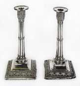 GEORGE V PAIR OF MOULDED AND WEIGHTED SILVER TABLE CANDLESTICKS, each of cluster column form with