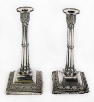 GEORGE V PAIR OF MOULDED AND WEIGHTED SILVER TABLE CANDLESTICKS, each of cluster column form with