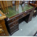 A MAHOGANY DOUBLE PEDESTAL DESK, HAVING 2 BANKS OF FOUR DRAWERS, WITH GREEN INSET TOP