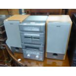 A SONY STACKING STEREO SYSTEM HAVING 5 CD CHANGER AND A PAIR OF SPEAKERS AND A MATSUI MIDI 85cd
