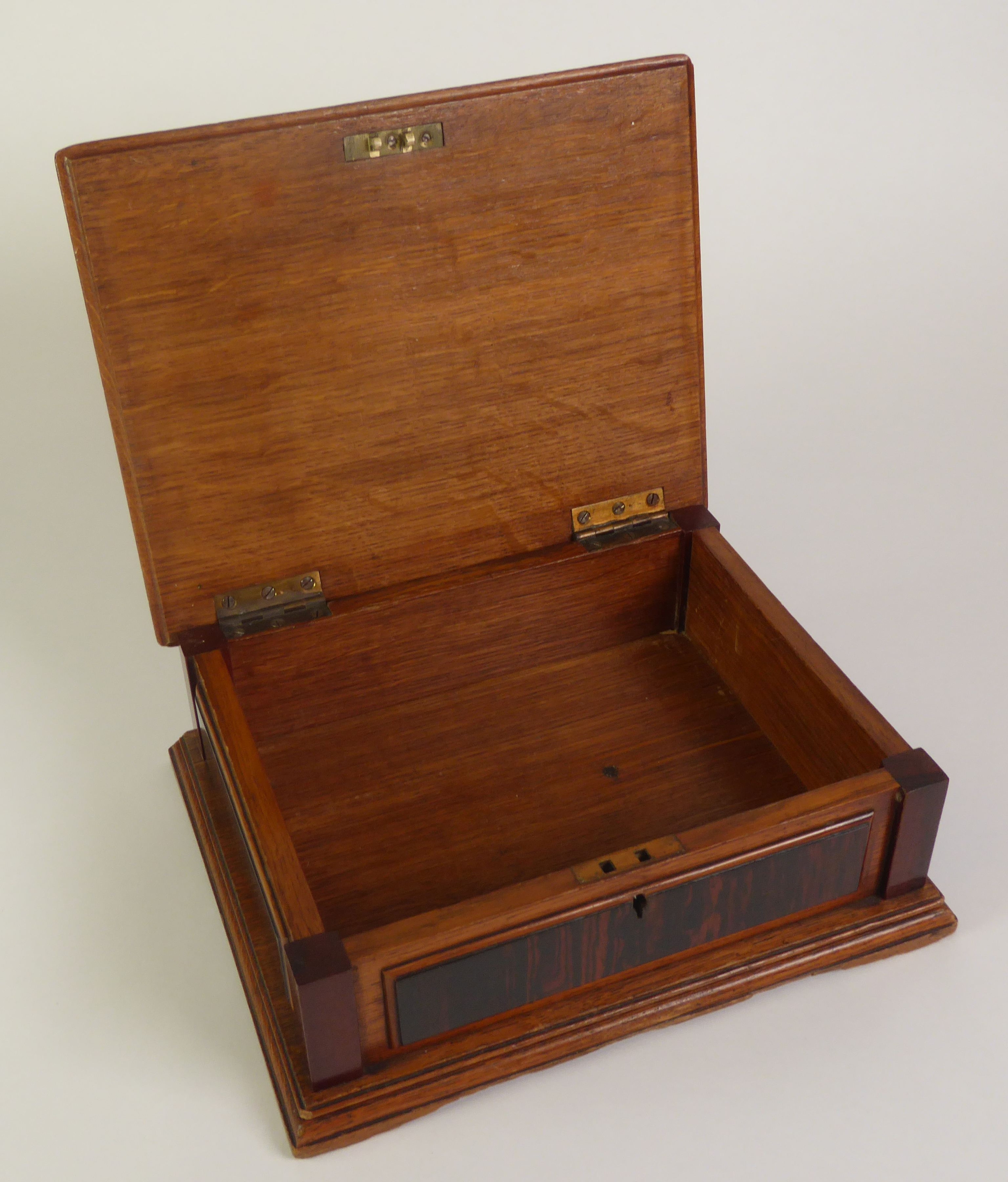 EARLY TWENTIETH CENTURY OAK, EBONY AND MAHOGANY TABLE CIGAR BOX. With raised panels to the top and - Image 2 of 2