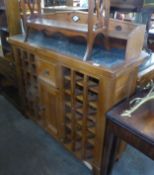 WINE RACK; GRANITE TOP GALLERIED PINE WINE RACK CABINET WITH CENTRAL DRAWER AND CUPBOARD, 51" (