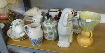 A COLCLOUGH PART TEA SERVICE, A POTTERY CLOCK SHAPED NOVELTY TEAPOT, A MANTEL DOG, POTTERY FISH