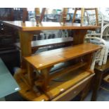 A PINE KITCHEN BENCH SET OF AN OBLONG TABLE AND TWO BENCHES (3)