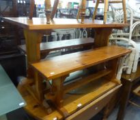 A PINE KITCHEN BENCH SET OF AN OBLONG TABLE AND TWO BENCHES (3)
