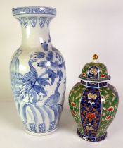 MODERN CHINESE GINGER JAR AND COVER, of panelled form, decorated in colours and gilt with stylised