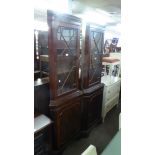 A PAIR OF MAHOGANY DOUBLE CORNER CUPBOARDS