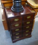 A BRASS INLAID SMALL CHEST OF DRAWERS, HAVING TWO BANKS OF FIVE SMALL DRAWERS WITH INSET BRASS