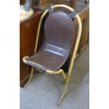 MID TWENTIETH CENTURY TUBULAR STEEL CHAIR, C. 1960s, PLUS A BARREL TOP TABLE WITH WALL MOUNT (2)