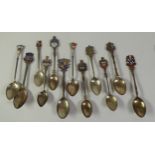 SEVEN SILVER SOUVENIR SPOONS WITH ENAMELLED TOPS, together with ANOTHER, EDINBURGH, not enamelled,