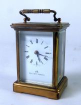 MATTHEW NORMAN, SWITZERLAND, 20th Century brass and bevelled plate glass CARRIAGE CLOCK, with